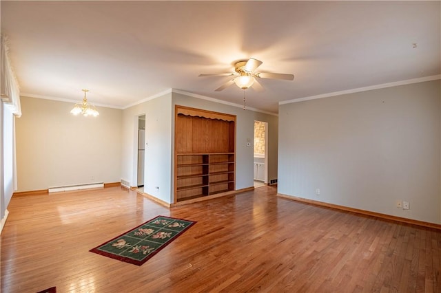 empty room with a baseboard radiator, baseboards, and wood finished floors