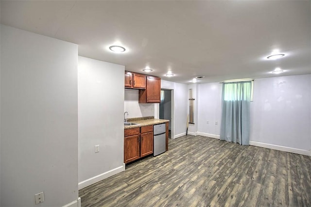 3985 E Cerro Gordo St, Decatur, IL 62521 - kitchen with refrigerator, dark wood-type flooring, baseboards, and brown cabinets