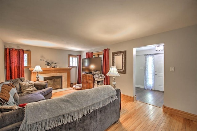 3985 E Cerro Gordo St, Decatur, IL 62521 - living area featuring baseboards, light wood-style floors, and a fireplace