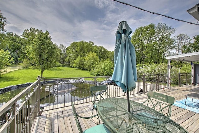 3985 E Cerro Gordo St, Decatur, IL 62521 - deck featuring a lawn, view of scattered trees, and outdoor dining space