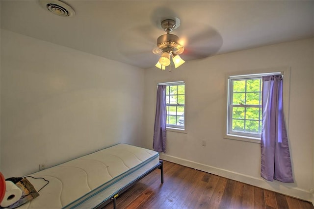 3985 E Cerro Gordo St, Decatur, IL 62521 - bedroom with baseboards, wood-type flooring, and ceiling fan