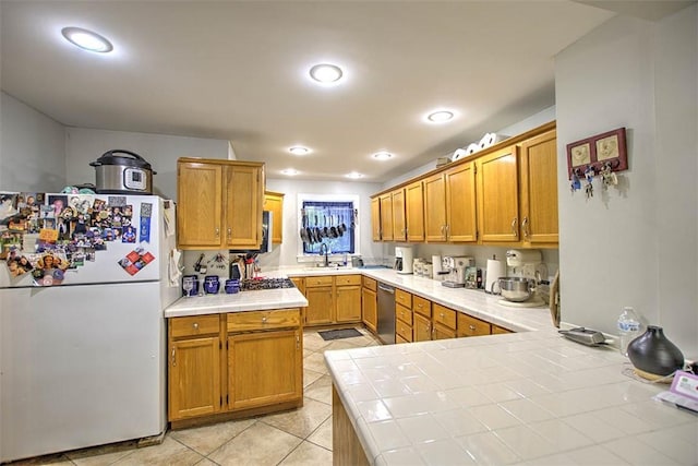 3985 E Cerro Gordo St, Decatur, IL 62521 - kitchen with freestanding refrigerator, tile counters, light tile patterned flooring, stainless steel dishwasher, and recessed lighting