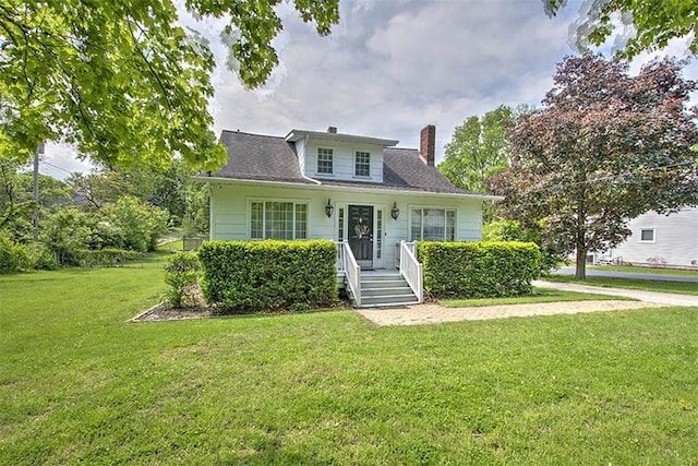 3985 E Cerro Gordo St, Decatur, IL 62521 - bungalow-style home with a chimney and a front lawn