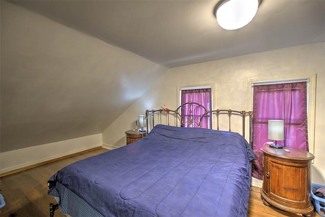 3985 E Cerro Gordo St, Decatur, IL 62521 - bedroom featuring wood finished floors, lofted ceiling, and baseboards