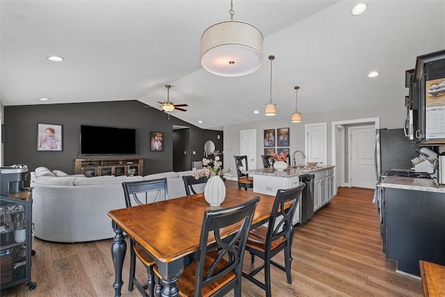 1121 Meadow Brook Ct, Mattoon, IL 61938 - dining area with light wood finished floors, lofted ceiling, a ceiling fan, and recessed lighting