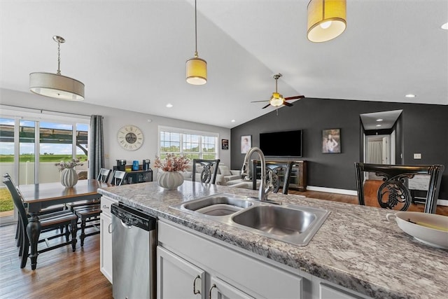 1121 Meadow Brook Ct, Mattoon, IL 61938 - kitchen featuring dishwasher, wood finished floors, a ceiling fan, vaulted ceiling, and white cabinetry