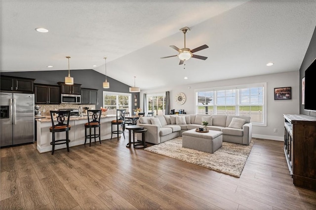 1121 Meadow Brook Ct, Mattoon, IL 61938 - living room with lofted ceiling, a ceiling fan, dark wood-style floors, and recessed lighting