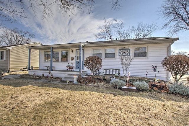 ranch-style home with a porch and a front lawn