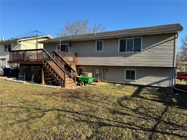 back of house with a yard, a deck, and stairs