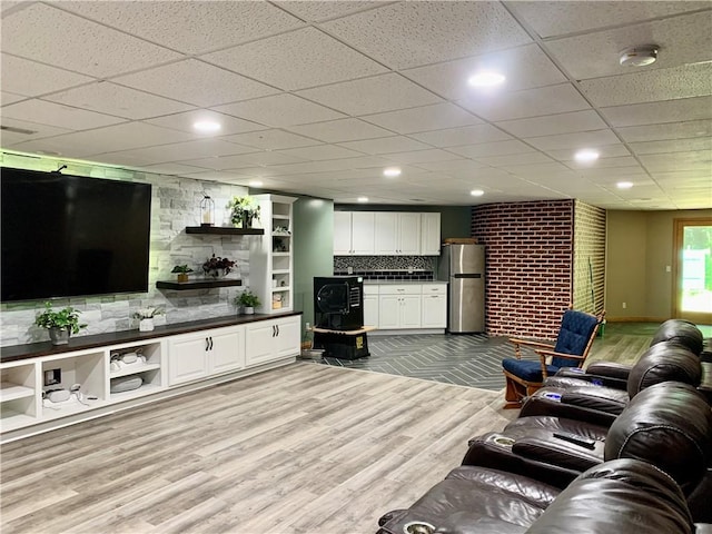 15690 E 1100th Ave, Effingham, IL 62401 - living area with light wood-style flooring and a paneled ceiling
