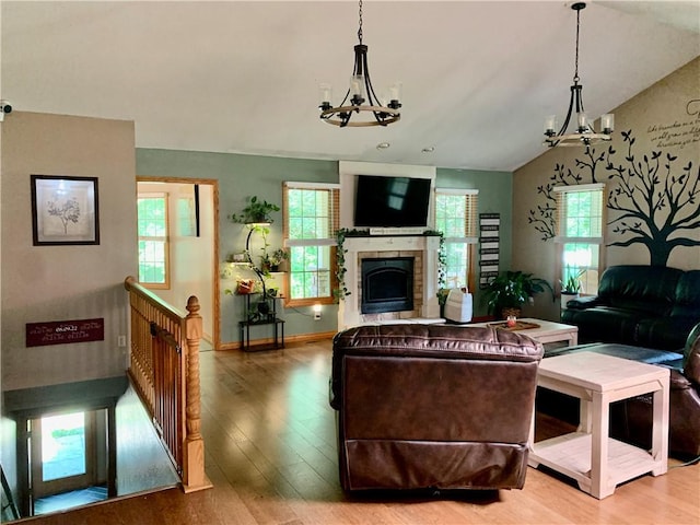 15690 E 1100th Ave, Effingham, IL 62401 - living room with a chandelier, light wood-type flooring, lofted ceiling, and a fireplace