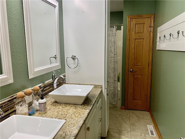 15690 E 1100th Ave, Effingham, IL 62401 - full bathroom featuring double vanity and decorative backsplash