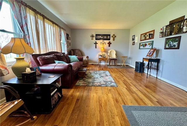 living room with light wood-style flooring and baseboards