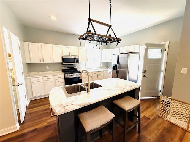 403 S 2nd Ave, Hoopeston, IL 60942 - kitchen featuring stainless steel appliances, a sink, white cabinets, dark wood finished floors, and recessed lighting