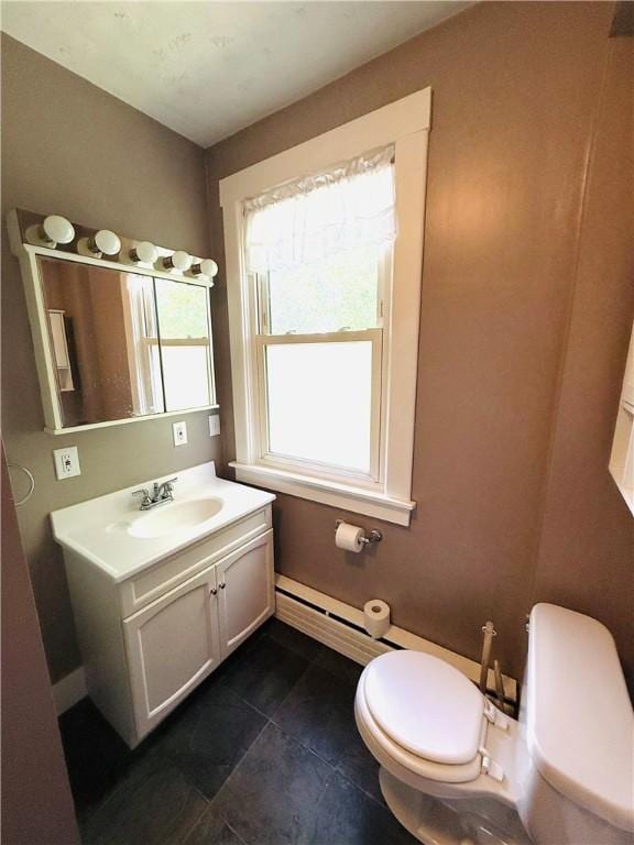 403 S 2nd Ave, Hoopeston, IL 60942 - bathroom featuring toilet, vanity, and tile patterned floors