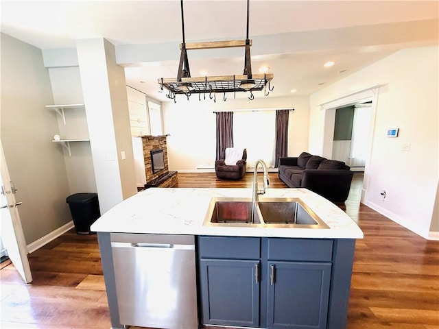 403 S 2nd Ave, Hoopeston, IL 60942 - kitchen with stainless steel dishwasher, a sink, open floor plan, dark wood-style flooring, and a chandelier
