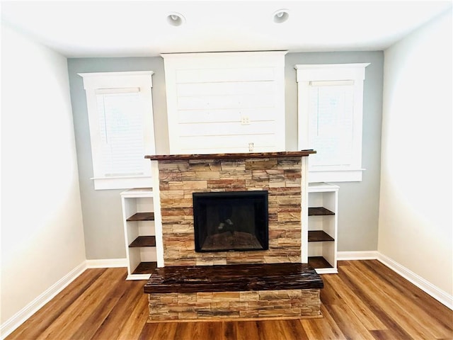403 S 2nd Ave, Hoopeston, IL 60942 - detailed view of baseboards, wood finished floors, a fireplace, and recessed lighting
