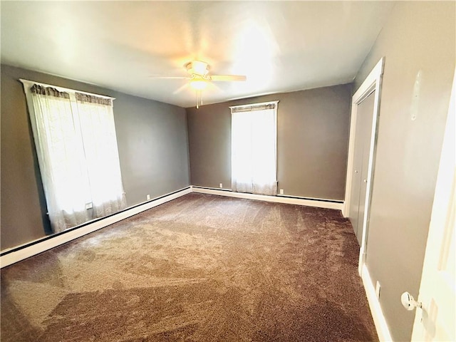 403 S 2nd Ave, Hoopeston, IL 60942 - unfurnished bedroom with carpet, baseboards, and ceiling fan