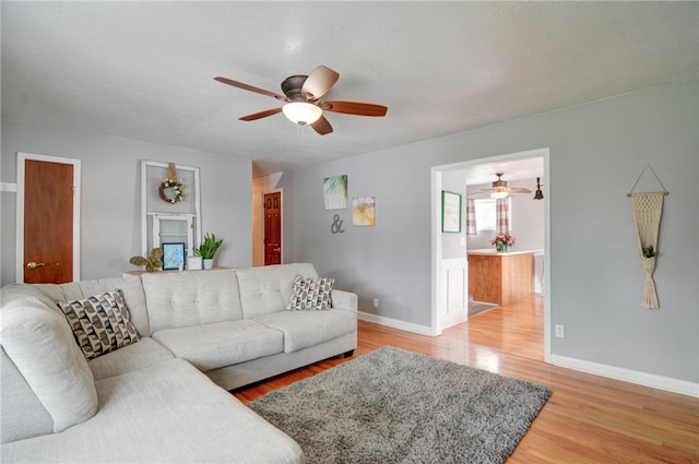 530 Sunset Dr, Mt Zion, IL 62549 - living area featuring ceiling fan, light wood-type flooring, and baseboards
