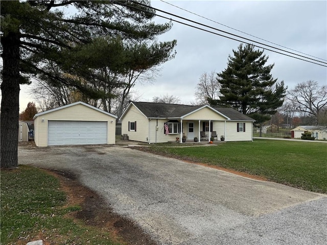 single story home with a garage, a front yard, an outbuilding, and covered porch