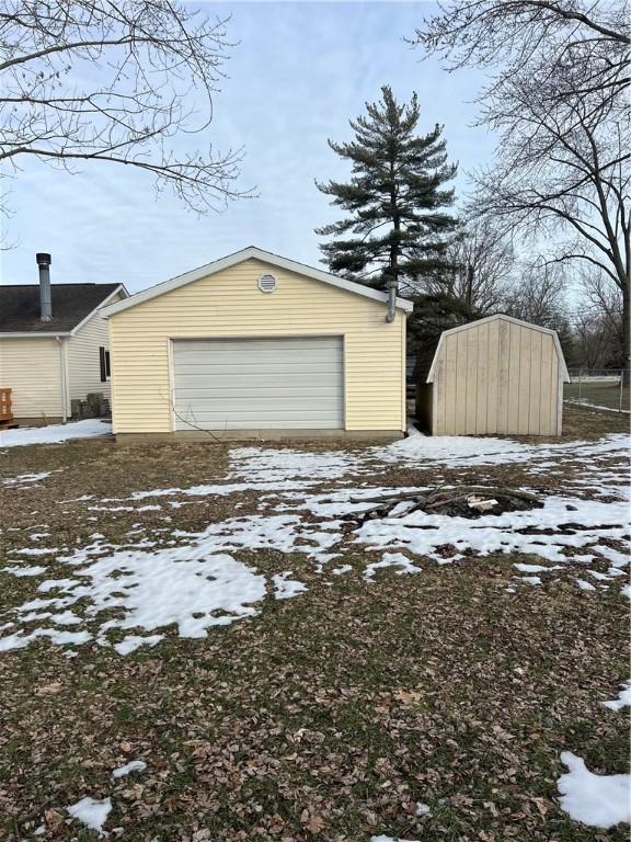 view of snow covered garage