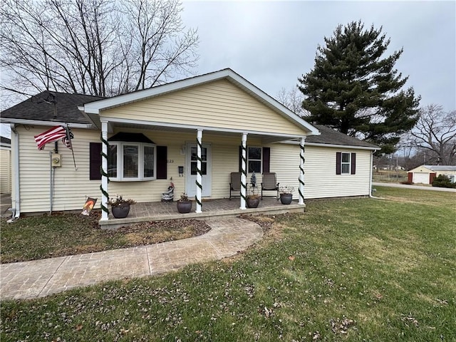 view of front of home featuring a front lawn and a porch