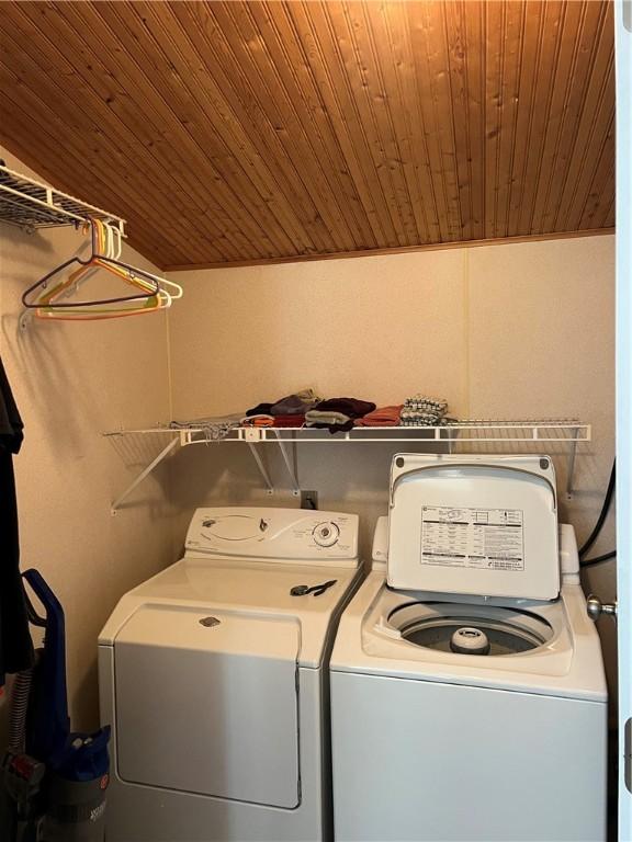 washroom featuring independent washer and dryer