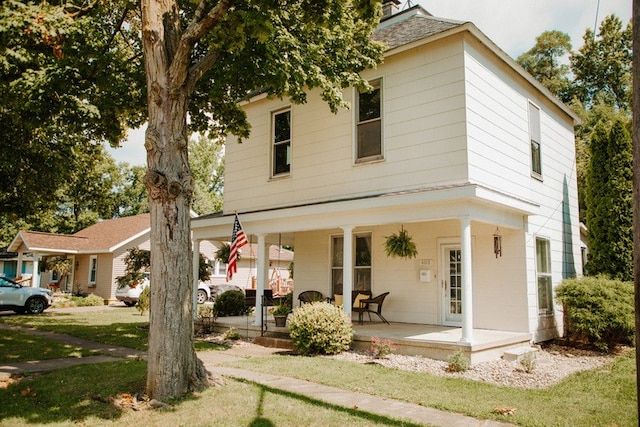 403 Maple St, Marshall, IL 62441 - view of front facade with covered porch and a front yard