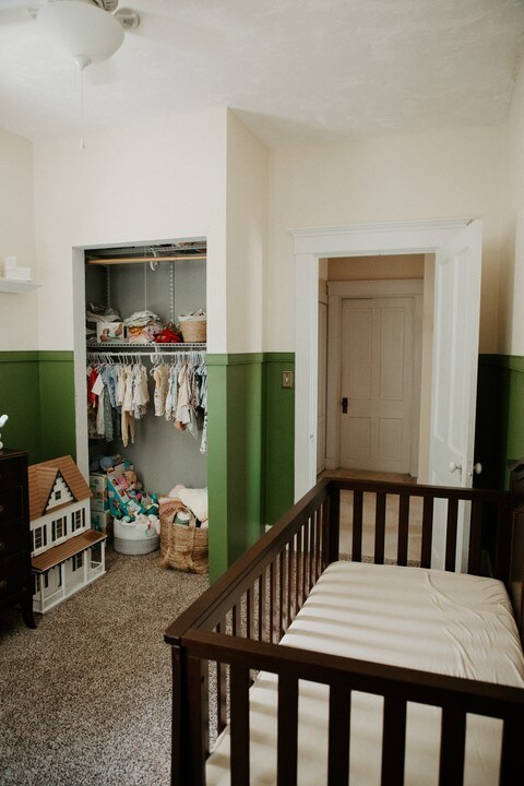 403 Maple St, Marshall, IL 62441 - bedroom featuring wainscoting, a closet, and ceiling fan