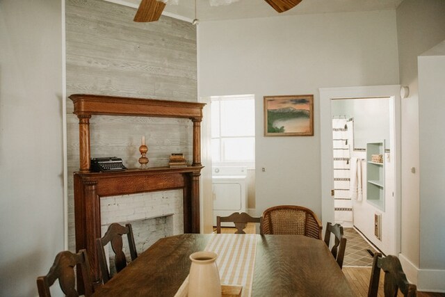 403 Maple St, Marshall, IL 62441 - dining room featuring a ceiling fan, washer / clothes dryer, and wood finished floors