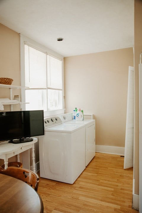 403 Maple St, Marshall, IL 62441 - laundry area featuring washing machine and clothes dryer and light wood finished floors