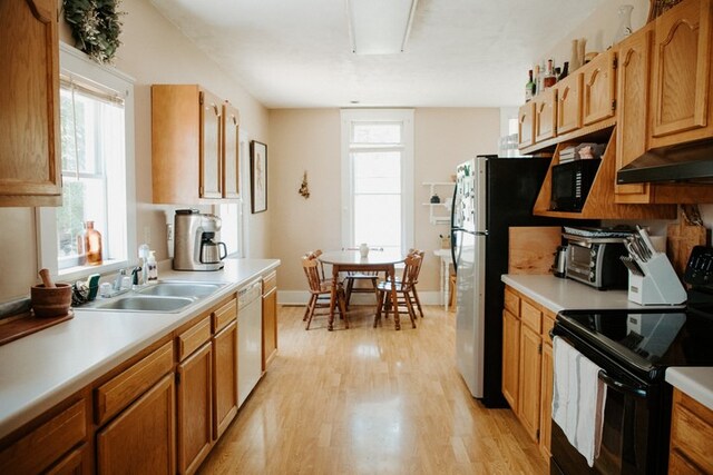 403 Maple St, Marshall, IL 62441 - kitchen featuring electric range, white dishwasher, light wood-style flooring, and light countertops