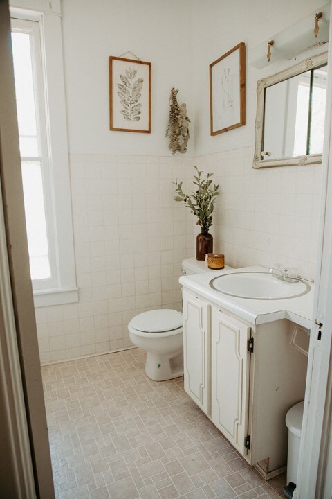 403 Maple St, Marshall, IL 62441 - half bath with tile walls, vanity, and wainscoting