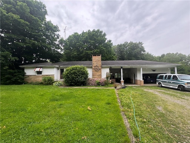 6272 Old Dam Rd, Georgetown, IL 61846 - view of front of property with a front lawn, an attached garage, and a chimney