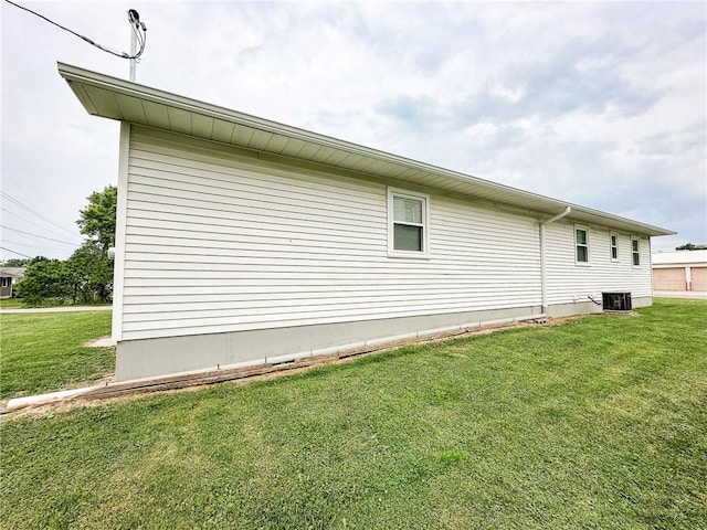 106 N Jefferson St, Greenup, IL 62428 - view of side of property with a yard and cooling unit