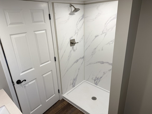 303 E Glenwood Ave, Olney, IL 62450 - bathroom featuring a marble finish shower and wood finished floors