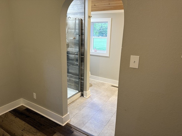 303 E Glenwood Ave, Olney, IL 62450 - bathroom featuring baseboards, a stall shower, and tile patterned flooring