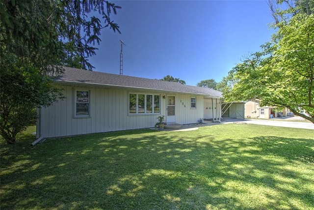 125 W Walnut St, Mt Zion, IL 62549 - single story home with a storage unit and a front lawn