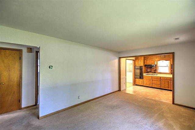 125 W Walnut St, Mt Zion, IL 62549 - unfurnished living room with light carpet and baseboards