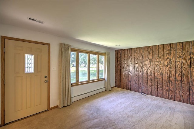 125 W Walnut St, Mt Zion, IL 62549 - foyer entrance with a baseboard heating unit and light colored carpet