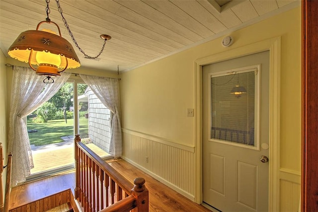 125 W Walnut St, Mt Zion, IL 62549 - entrance foyer featuring wooden ceiling, wood finished floors, ornamental molding, and a wainscoted wall