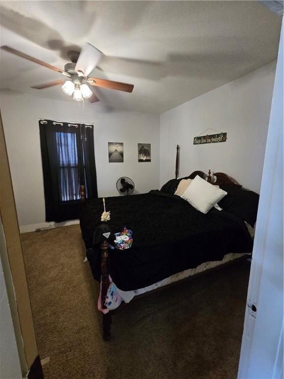 bedroom with carpet and a ceiling fan