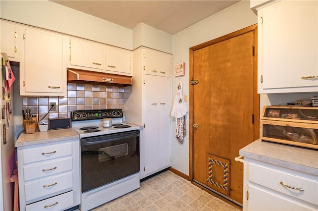 kitchen with electric range, white cabinets, light countertops, ventilation hood, and decorative backsplash