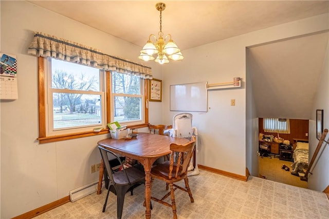 dining room featuring a baseboard heating unit, baseboards, and a notable chandelier