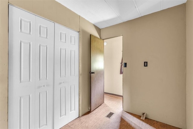 bedroom with visible vents and a closet