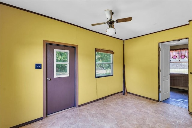 interior space with ornamental molding and baseboards