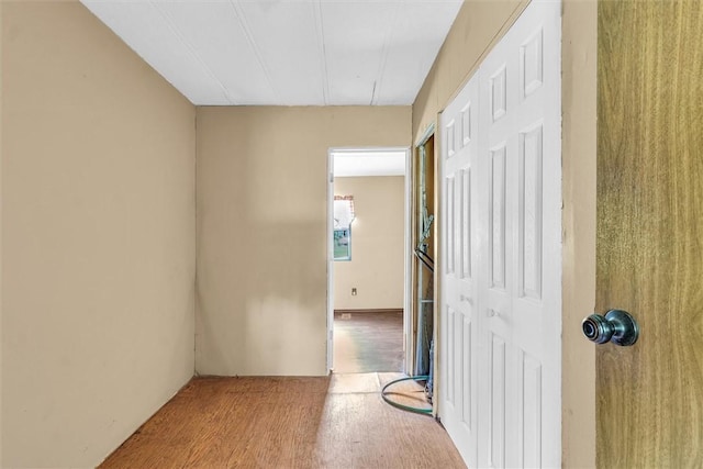 corridor featuring wood finished floors