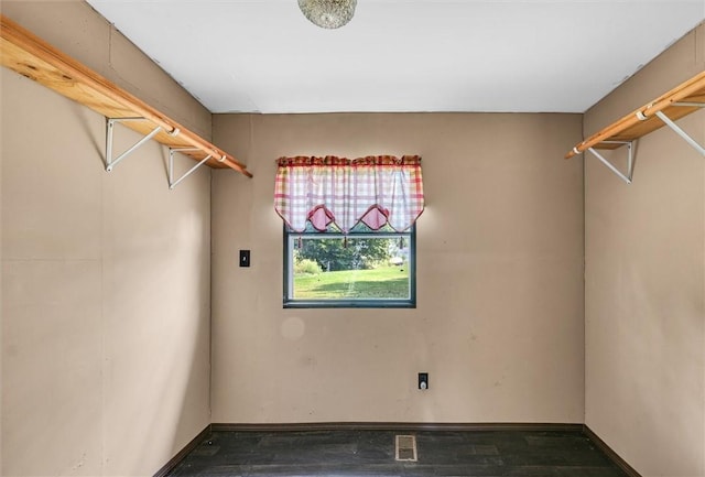 spacious closet featuring visible vents