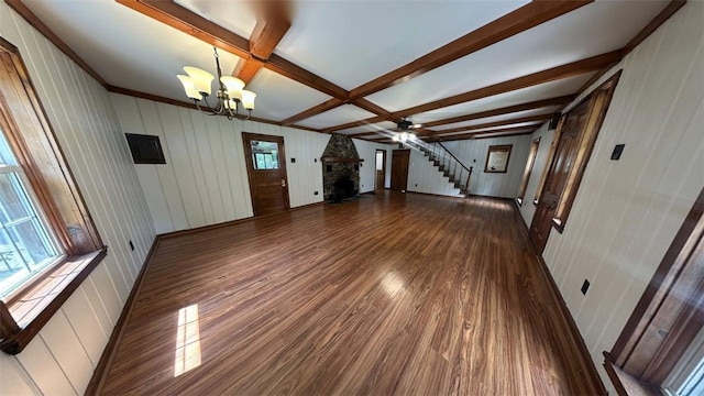3728 N Lake Blvd, Danville, IL 61832 - unfurnished living room with a chandelier, a fireplace, dark wood-type flooring, stairway, and beamed ceiling