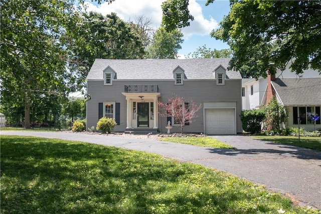 3728 N Lake Blvd, Danville, IL 61832 - view of front facade with asphalt driveway, a front lawn, and an attached garage